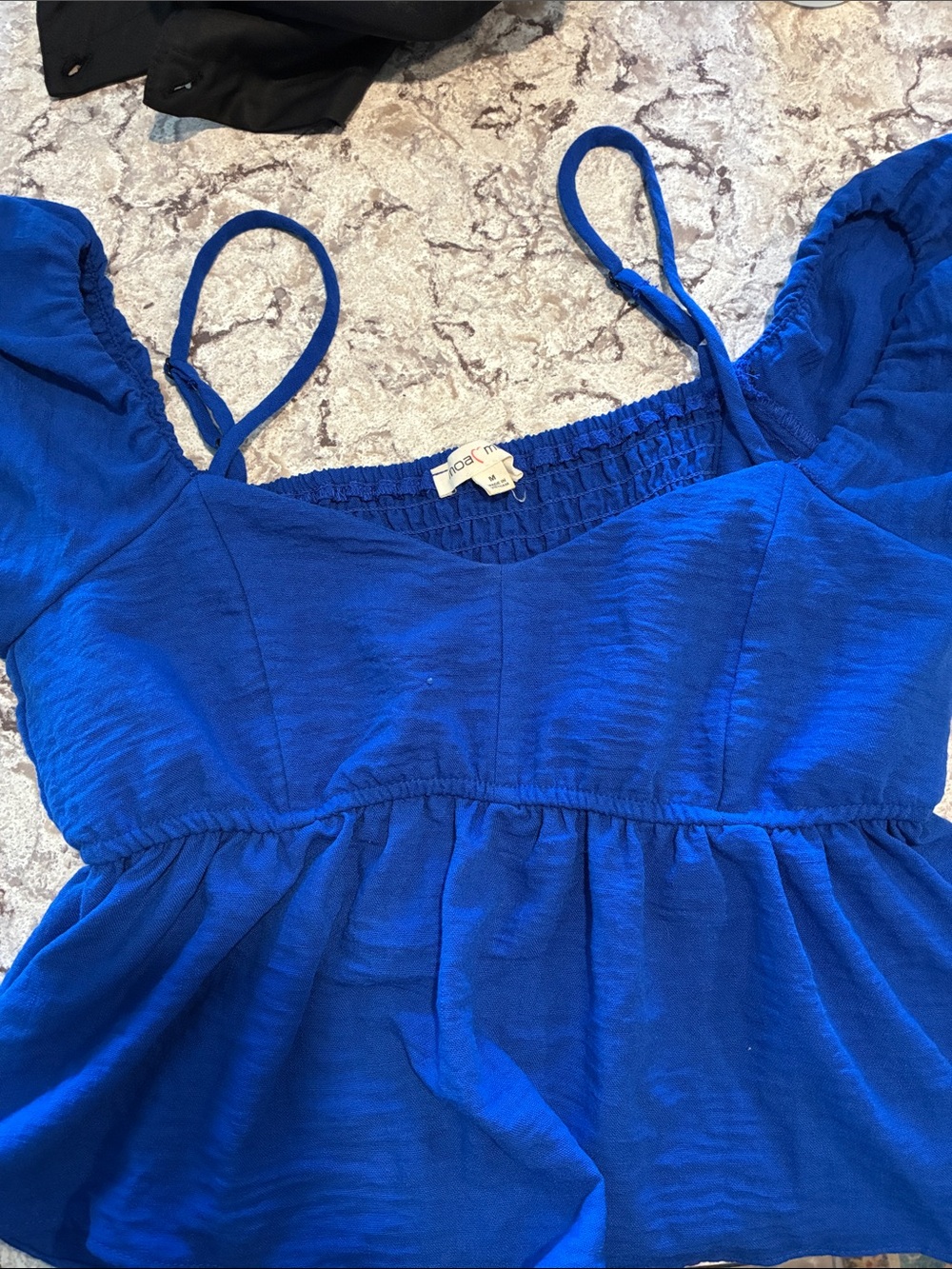 Blue women’s peplum tank